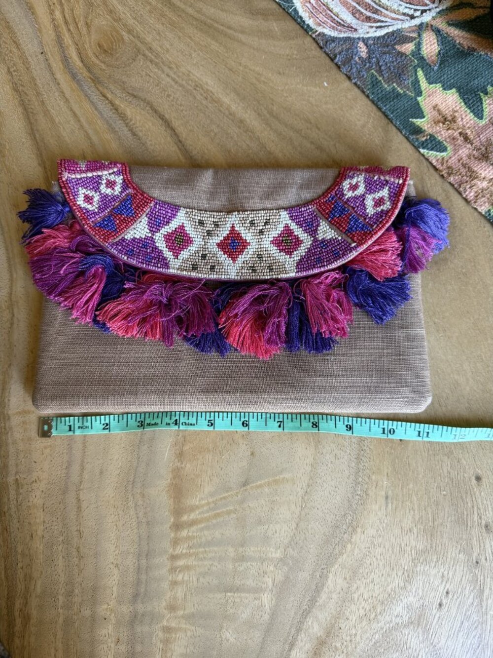 Chico's beige clutch with pink and purple beaded tassels